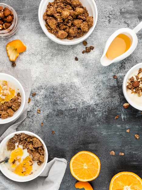 Top view breakfast bowls with granola and fruit