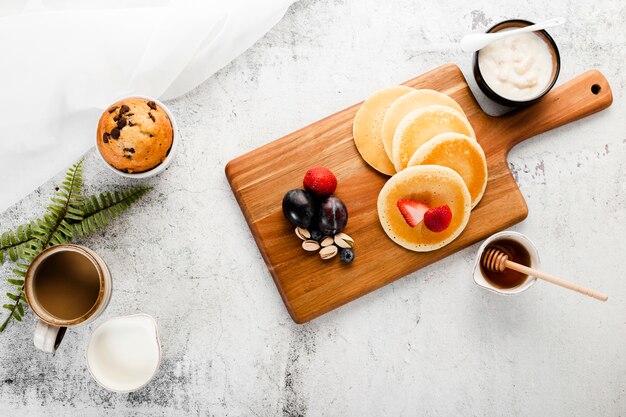 Top view breakfast pancakes on wooden top