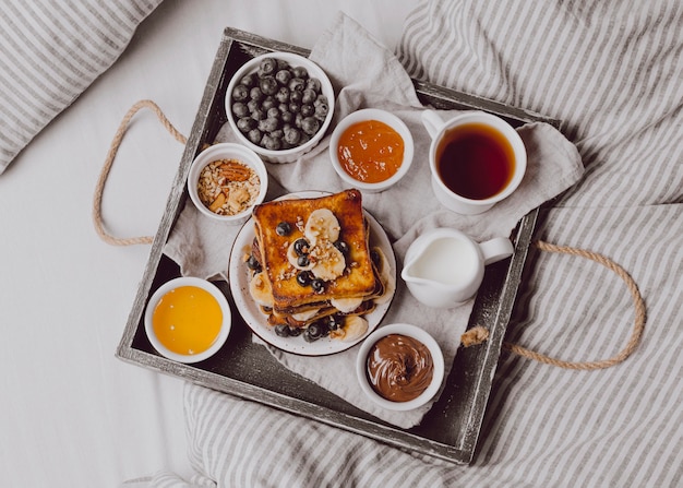 Top view of breakfast toast with fruits