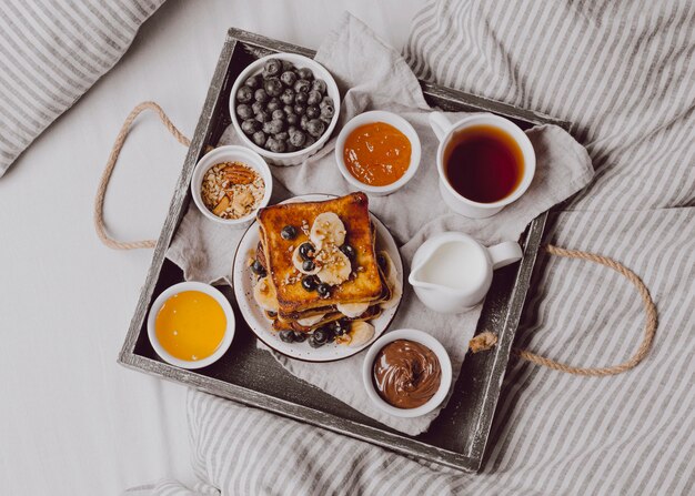 Top view of breakfast toast with fruits