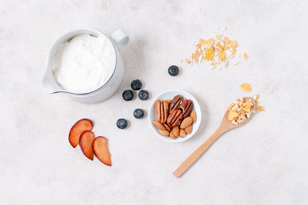 Top view breakfast with yogurt and fruits