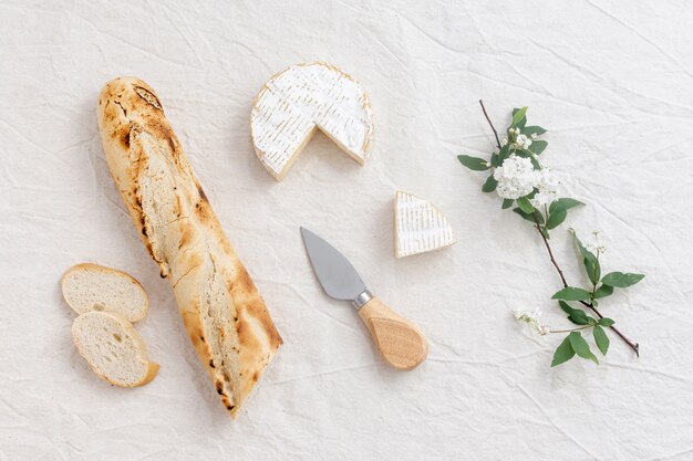 Top view brie cheese and a baguette