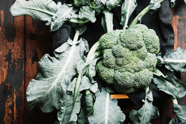 Top view broccoli with leaves in a basket