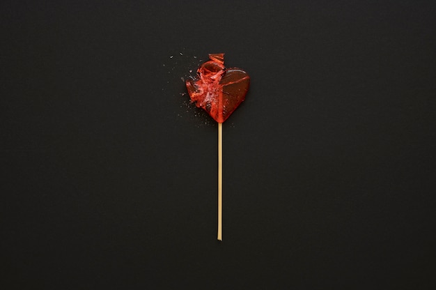 Top view of broken heart candy treat on stick