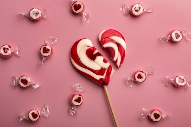 Free photo top view broken heart shaped candy