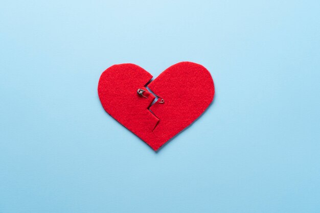 Top view broken heart with safety pin