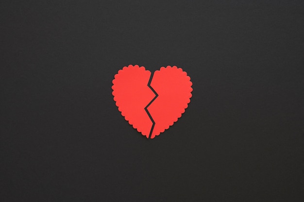 Top view of broken paper heart background