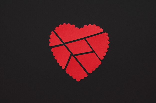 Top view of broken paper heart background