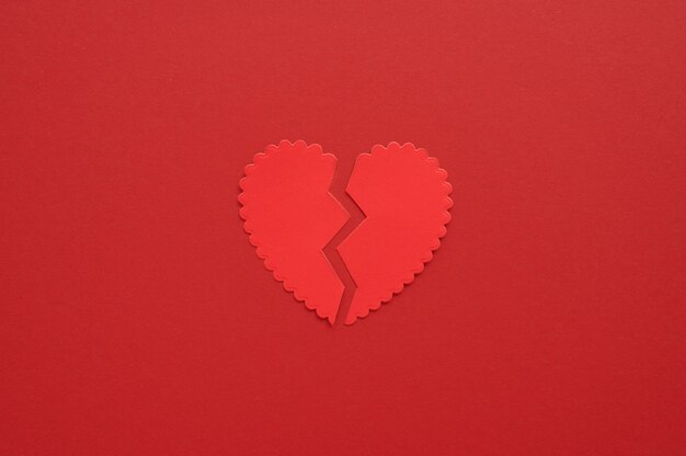 Top view of broken paper heart background