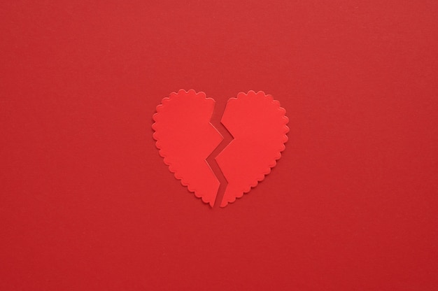 Top view of broken paper heart background