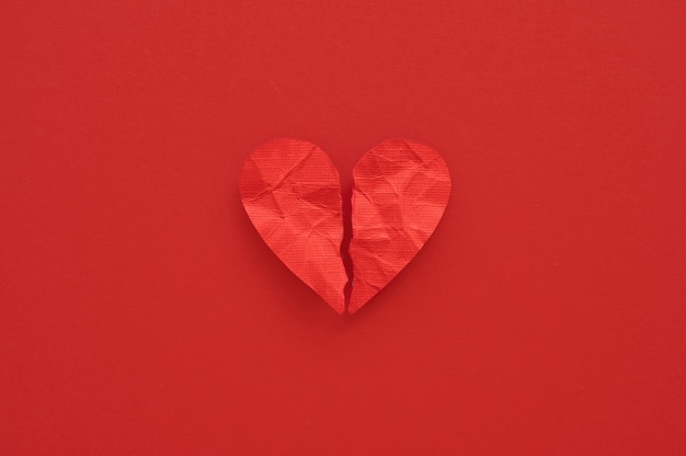 Top view of broken paper heart background