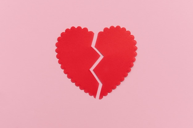 Top view of broken paper heart background