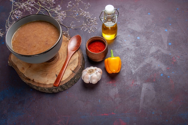 Top view brown bean soup with olive oil and garlic on dark surface soup vegetable meal food kitchen bean