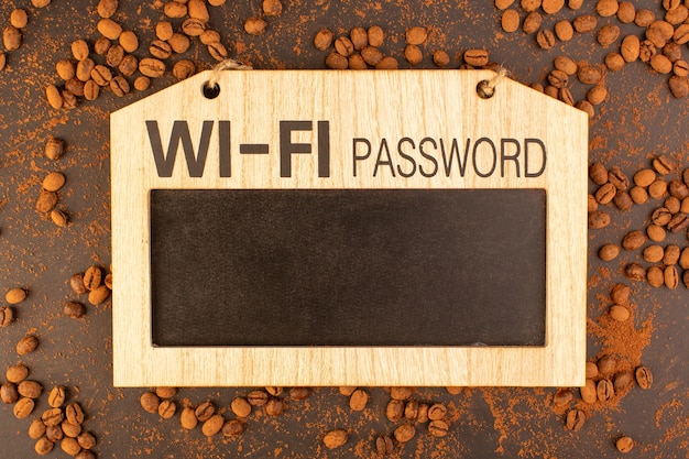 A top view brown coffee seeds with board. Wi-Fi password sign