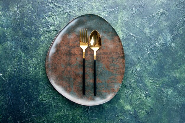 top view brown empty plate with golden spoon on dark background restaurant food kitchen meal utencil cutlery dinner