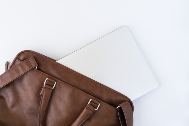 Free photo top view of brown handbag with tablet