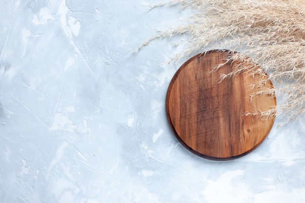 Top view of brown round desk, for food on light, wood wooden food