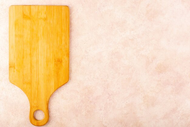 A top view brown wooden desk empty isolated on the pink background wood tree