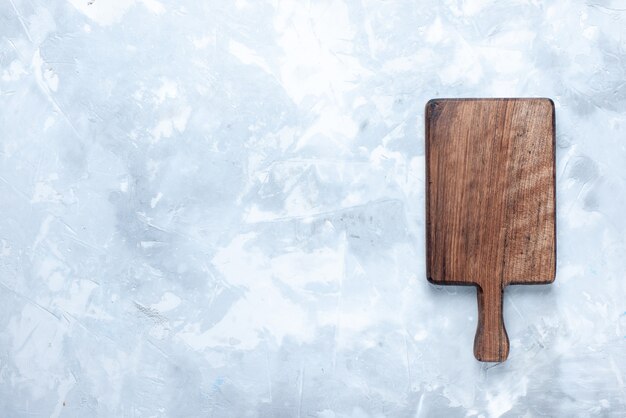 Top view of brown wooden desk, for food and vegetables on light, wood wooden