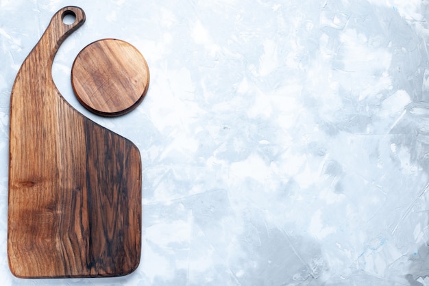 Top view of brown wooden desk, isolated on light, wood wooden light food