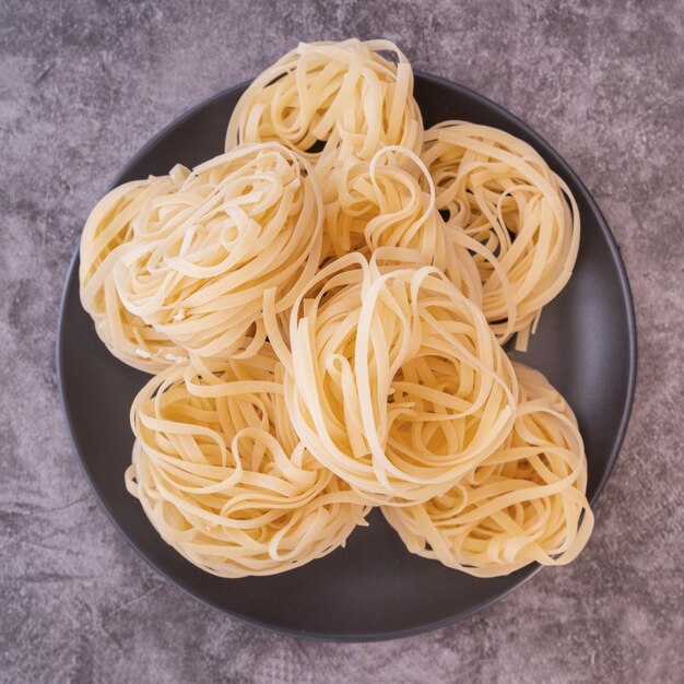 Top view built up raw pasta on dish