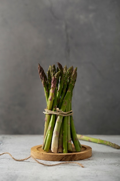 Top view bunch of asparagus on wooden board