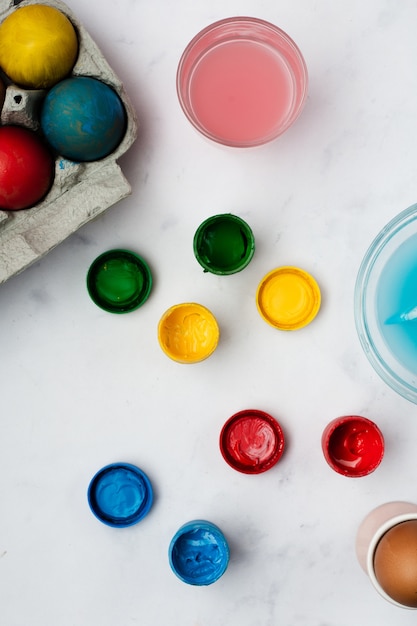 Top view bunch of eggs colored with paint for easter