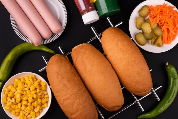 Free photo top view of buns and sausages to make hot dogs