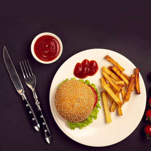 Top view burger and french fries on a plate