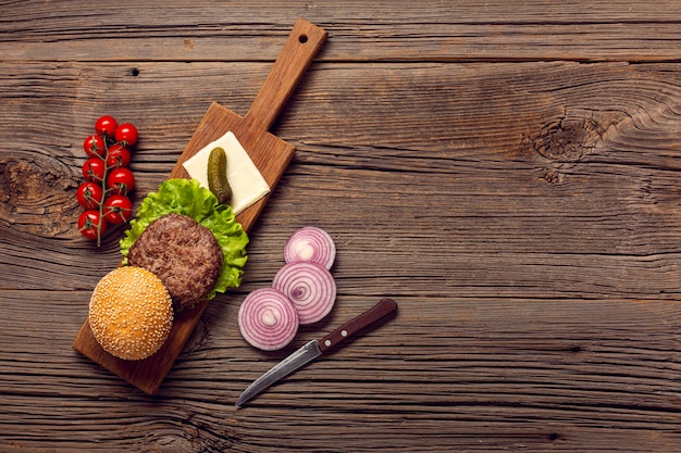 Top view burger ingredients on a cutting board