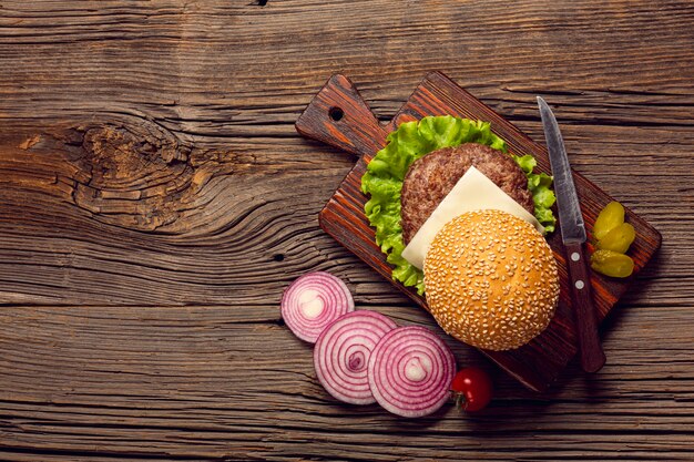 Top view burger ingredients on wooden table