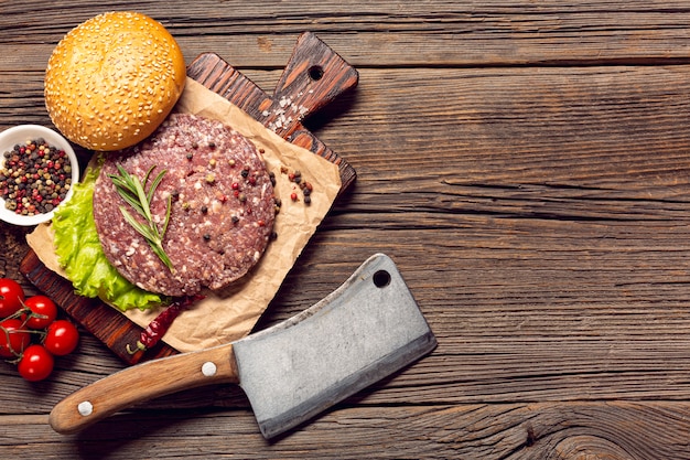 Top view burger ingredients on a wooden table
