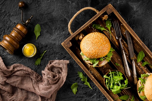 Top view burgers in basket with copy-space and kitchen towel