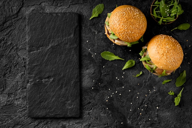 Top view burgers on counter with copy-space