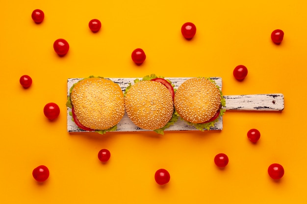 Top view burgers on cutting board