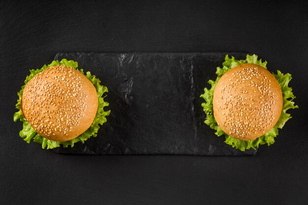 Top view burgers on slate board