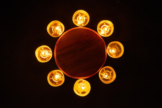 Top view of burning candles as memory for fallen dark wall