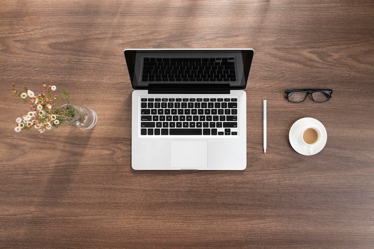Free Photo top view business desk arrangement with laptop