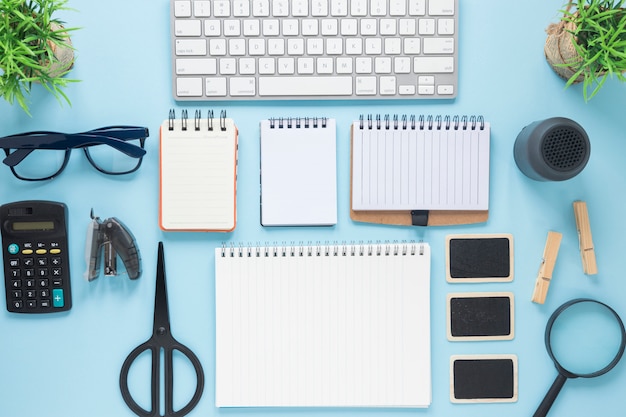 Top view of business mockup on the blue office desk