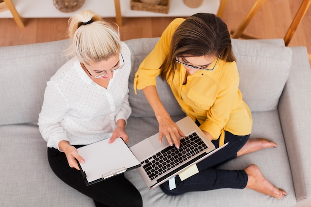 Top view business women working on laptop