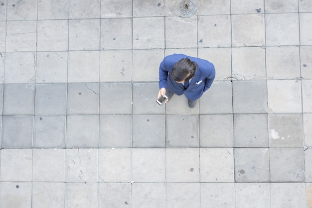 Free photo top view of a businessman standing in front of office.