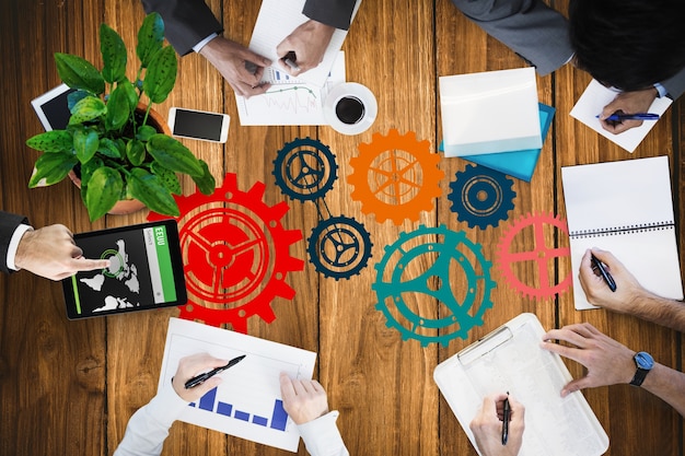 Free photo top view of businesspeople working with icons painted on the table