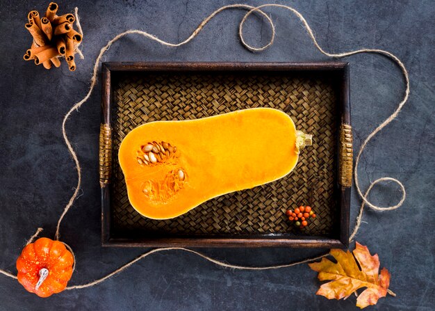 Top view butternut squash half on wooden tray