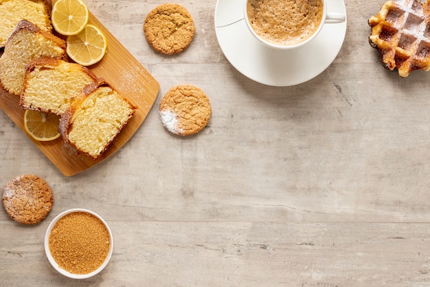 Top view cake cookies and coffee