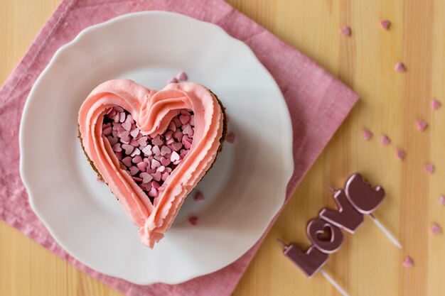 Top view of cake slice with frosting and candles