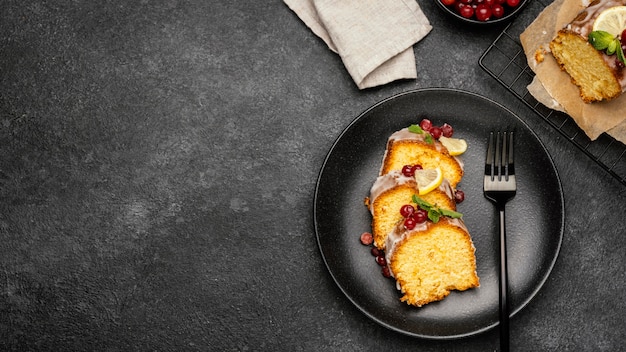 Top view of cake slices on plate with berries and copy space