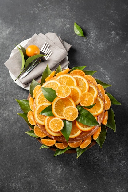 Free photo top view of cake with orange slices