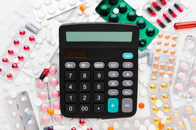 Top view calculator and various types of pills