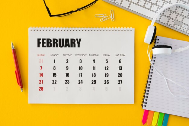 top view calendar and headphones