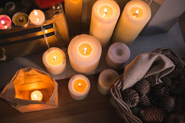 Top view of candles and pine cones